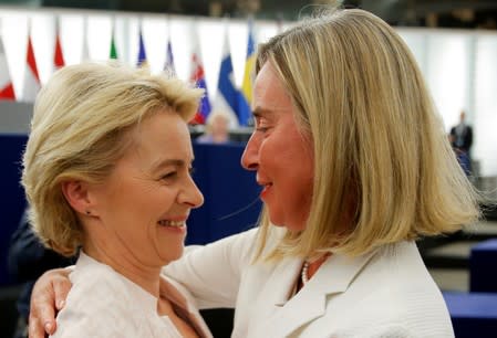 Elected European Commission President Ursula von der Leyen is congratulated by European Union High Representative for Foreign Affairs and Security Policy Federica Mogherini after a vote on her election at the European Parliament in Strasbourg