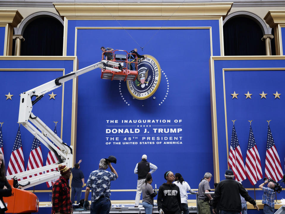 Workers assemble the stage for the Commander-in-Chief Ball at the National Building Museum: EPA