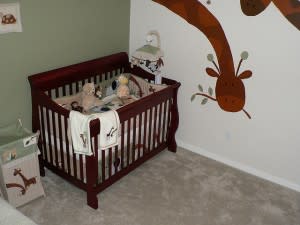 Two colour room with brown giraffes and unfinished floor