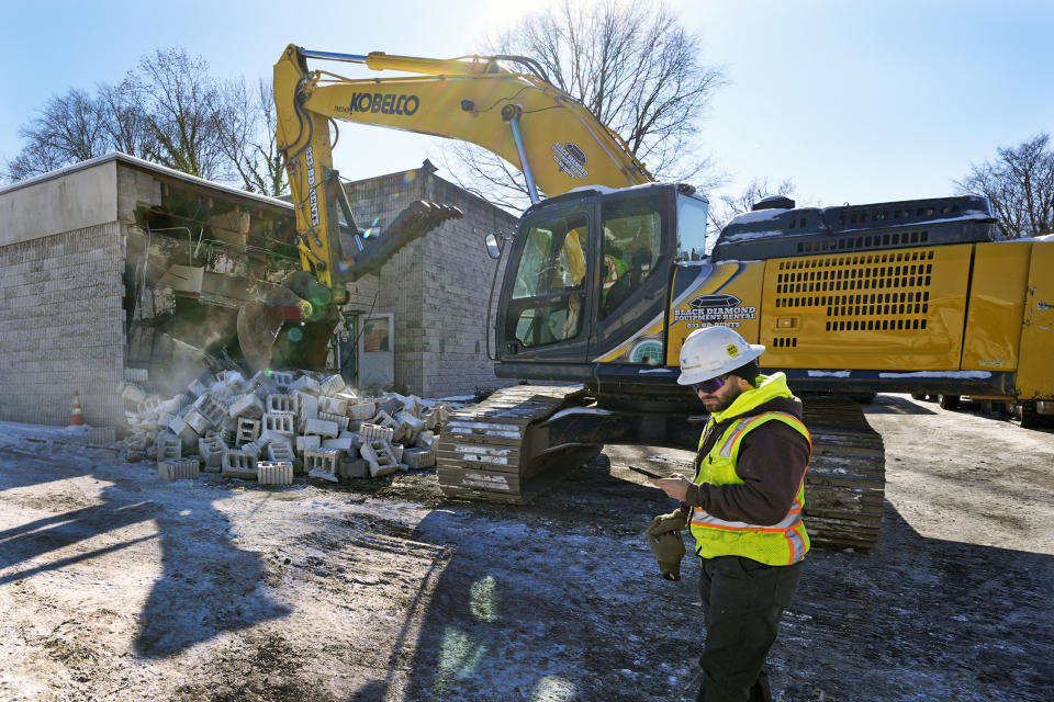 Workers begin demolition Wednesday, Jan. 17, 2023, at the Tree of Life building in Pittsburgh, the site of the deadliest antisemitic attack in U.S. history, as part of the effort to reimagine the building to honor the 11 people who were killed there in 2018. Most of the building will be removed, although parts of the sanctuary walls will be preserved. The new building will include spaces for worship, a museum, an education center and a movie theater. (AP Photo/Gene J. Puskar)