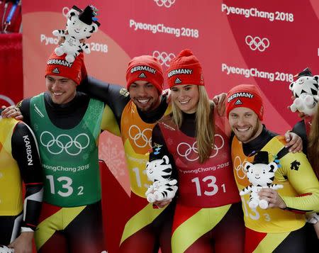 Luge - Pyeongchang 2018 Winter Olympic Games - Team Relay - Pyeongchang, South Korea - February 15, 2018 - Gold medalists Natalie Geisenberger, Johannes Ludwig, Tobias Wendl and Tobias Arlt of Germany during the victory ceremony. REUTERS/Arnd Wiegmann