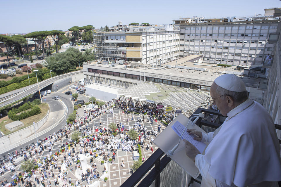 Pope Francis appears at a balcony of the Agostino Gemelli Polyclinic in Rome, Sunday, July 11, 2021, where he was hospitalized for intestine surgery, to deliver his traditional Sunday blessing. (Vatican Media via AP)