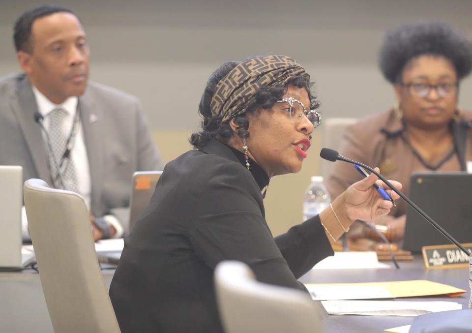 Akron School Board Vice President Carla Jackson addresses board members during a special meeting Wednesday. At left is Superintendent Michael Robinson and President Diana Autry is at right.