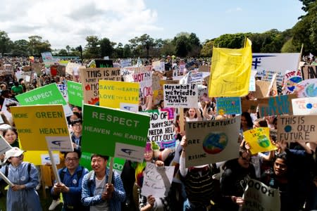 People take part in a protest to call for action on climate change in Sydney