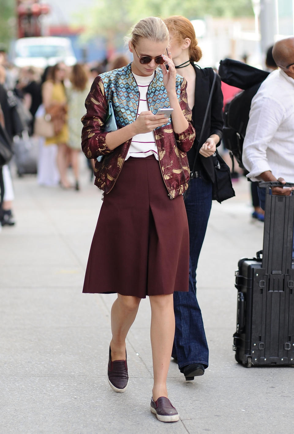 A street style star wearing a bomber jacket New York Fashion Week.