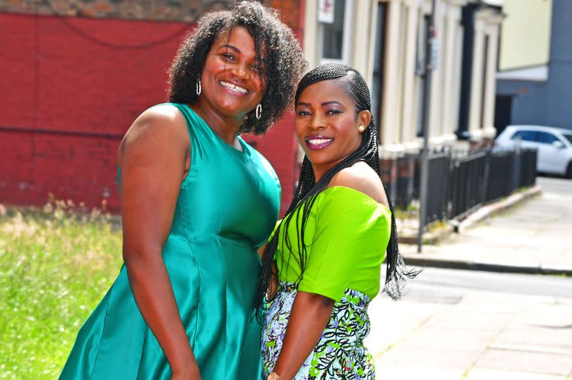 Isabel Lopes at her new clothes design shop on Upper Warwick Street in Toxteth with Mena Tando (R) wearing one her Isabel's designs. Photo by Colin Lane