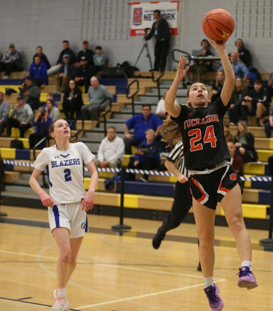 Tuckahoe's Brooke Matarazzo takes a layup ahead of Millbrook's Hannah Ross during the New York State Class C regional final on March 7, 2024.