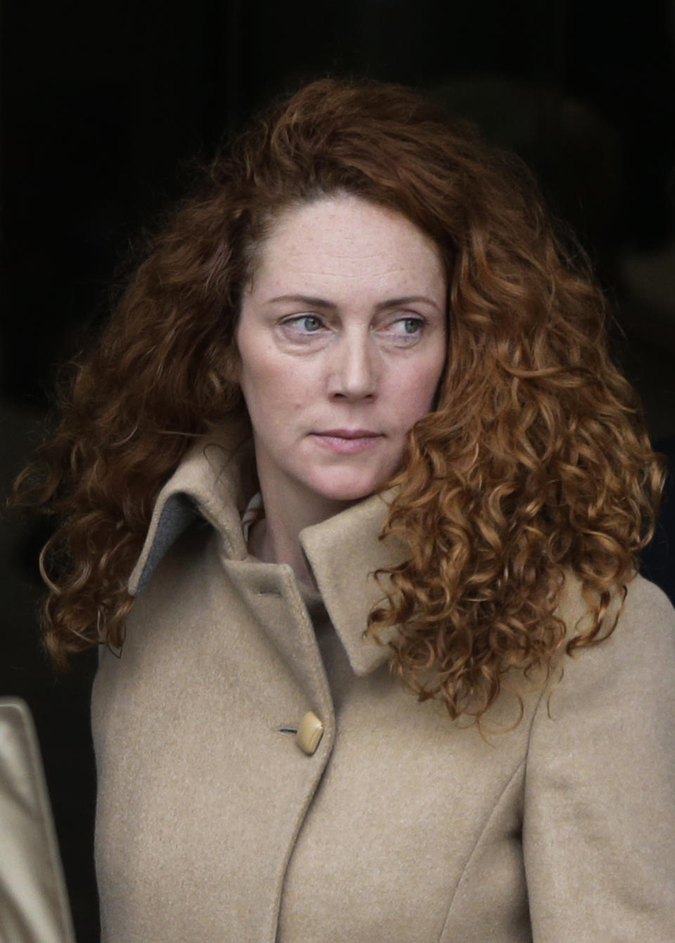 Rebekah Brooks, the former chief of News Corp.'s British operations, leaves the Old Bailey court in London London, Wednesday, Sept. 26, 2012. Rebekah Brooks and Andy Coulson, the ex-communications chief for Prime Minister David Cameron, learned Wednesday that they will face trial next September over allegations linked to phone hacking. (AP Photo/Lefteris Pitarakis)