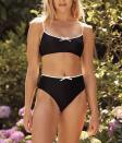 <p><strong>Summersalt </strong></p><p>summersalt.com</p><p><strong>$60.00</strong></p><p><a href="https://www.summersalt.com/products/the-contrast-mini-bow-wanderlust-bikini-top-in-sea-urchin-white-sand" rel="nofollow noopener" target="_blank" data-ylk="slk:Shop Now;elm:context_link;itc:0;sec:content-canvas" class="link ">Shop Now</a></p><p><strong><del>$60</del> $42 (30% off with code)</strong></p><p>Sporty and sweet, this pretty bow-adorned top is a swimwear staple. </p>