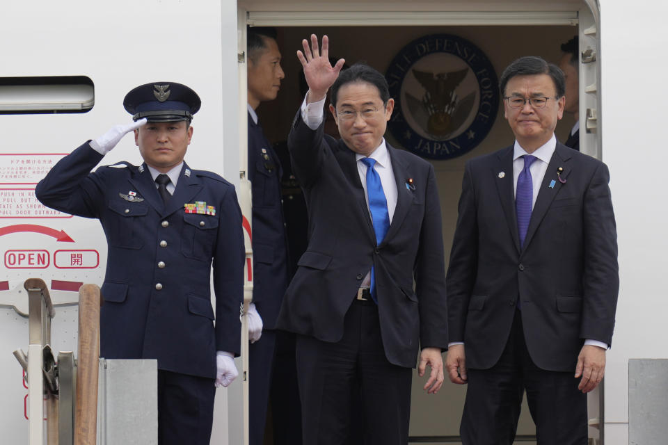 Japanese Prime Minister Fumio Kishida, center, waves as he boards the plane to leave after attending the trilateral meeting with South Korean President Yoon Suk Yeol and Chinese Premier Li Qiang, at the Seoul airport in Seongnam, South Korea, Monday, May 27, 2024. (AP Photo/Lee Jin-man)