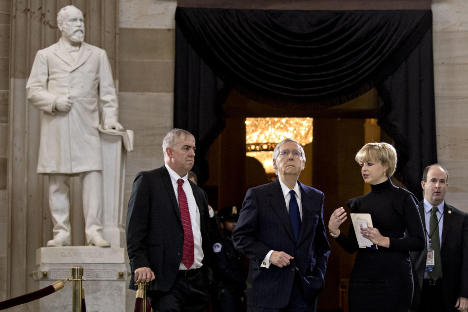 <p>Senate Majority Leader Mitch McConnell, a Republican from Kentucky, center, conducts a walkthrough before a service for the late Reverend Billy Graham at the U.S. Capitol Rotunda in Washington on Wednesday, Feb. 28, 2018. (Photo: Andrew Harrer/Bloomberg via Getty Images </p>