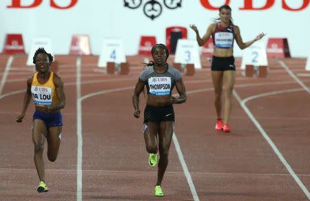 Athletics - IAAF Athletics Diamond League meeting Lausanne - Stade Olympique de la Pontaise, Lausanne, Switzerland - 25/8/2016 - Jenna Prandini of the U.S. claims a false start as Elaine Thompson of Jamaica (C) and Marie-Jose Ta Lou of the Ivory Coast run during the women's 100m competition. REUTERS/Ruben Sprich