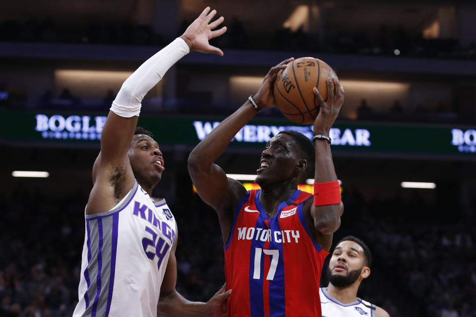 Detroit Pistons forward Tony Snell, right, goes to the basket against Sacramento Kings guard Buddy Hield, left, during the first half of an NBA basketball game in Sacramento, Calif., Sunday, March 1, 2020. (AP Photo/Rich Pedroncelli)