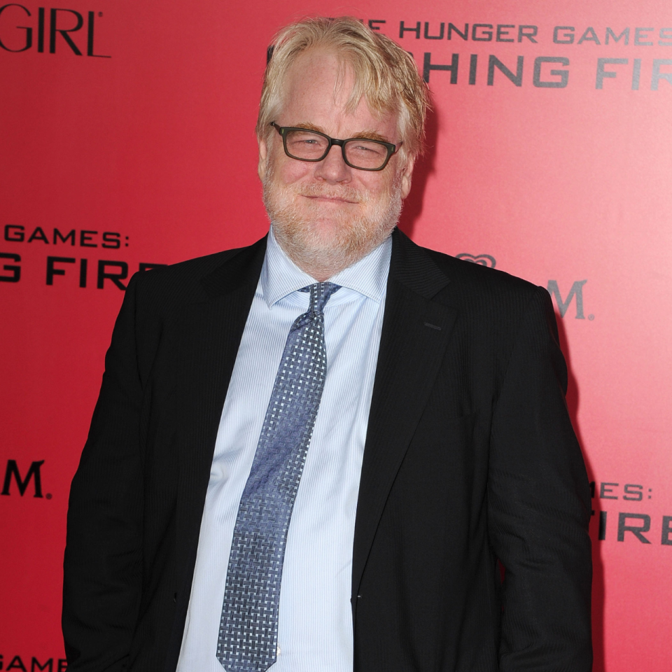 Philip Seymour Hoffman attends the Los Angeles Premiere of The Hunger Games: Catching Fire 2013, a few months before he tragically passed away