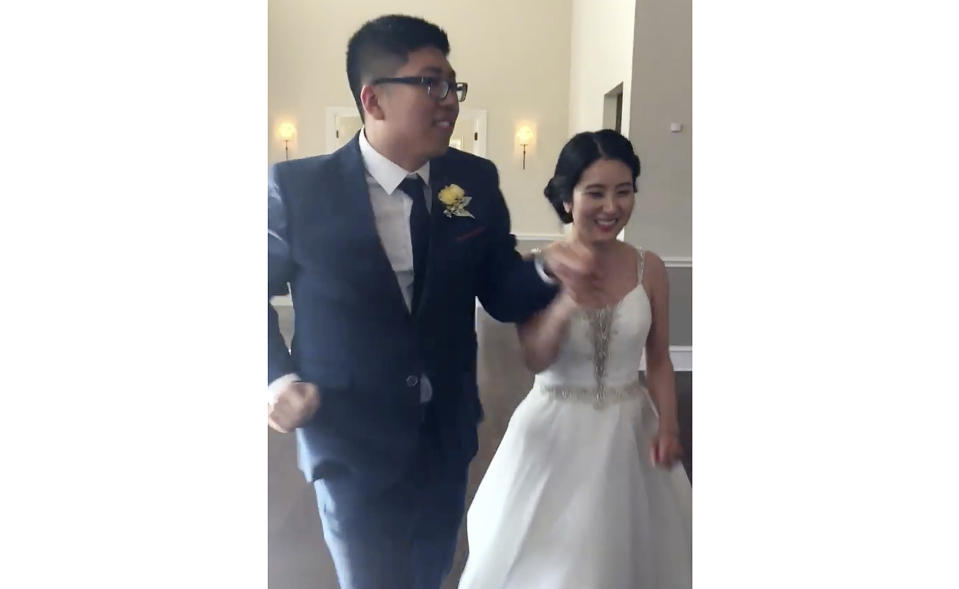 This photo provided by Young Min Kim shows the wedding of Kyu and Cindy Cho. Among the eight people killed when a gunman opened fire at a Texas shopping mall on May 6, 2023, were Kyu and Cindy Cho and their 3-year-old son James. Their family's only survivor that day was their 6-year-old son, who was wounded. (Young Min Kim via AP)