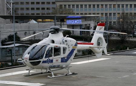 An helicopter stands outside the CHU Nord hospital in Grenoble, French Alps, where retired seven-times Formula One world champion Michael Schumacher is reported to be hospitalized after a ski accident, December 29, 2013. REUTERS/Robert Pratta
