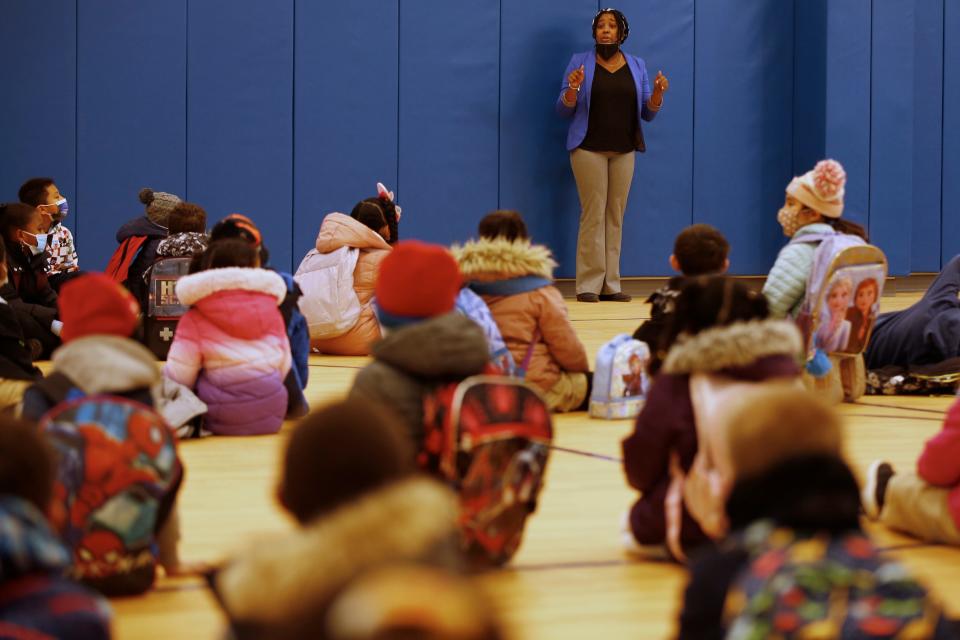 Taylor DeLoach, principal, speaks with students in the gymnasium before the first day of school at the new Alma del Mar Frederick Douglass campus on Church Street in New Bedford.