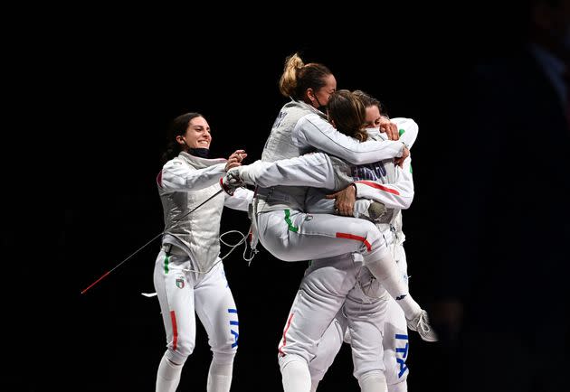 Italy's Arianna Errigo (R) celebrates with her teammates after winning against USA's Lee Kiefer in the women's foil team bronze medal bout during the Tokyo 2020 Olympic Games at the Makuhari Messe Hall in Chiba City, Chiba Prefecture, Japan, on July 29, 2021. (Photo by Mohd RASFAN / AFP) (Photo by MOHD RASFAN/AFP via Getty Images) (Photo: MOHD RASFAN via Getty Images)