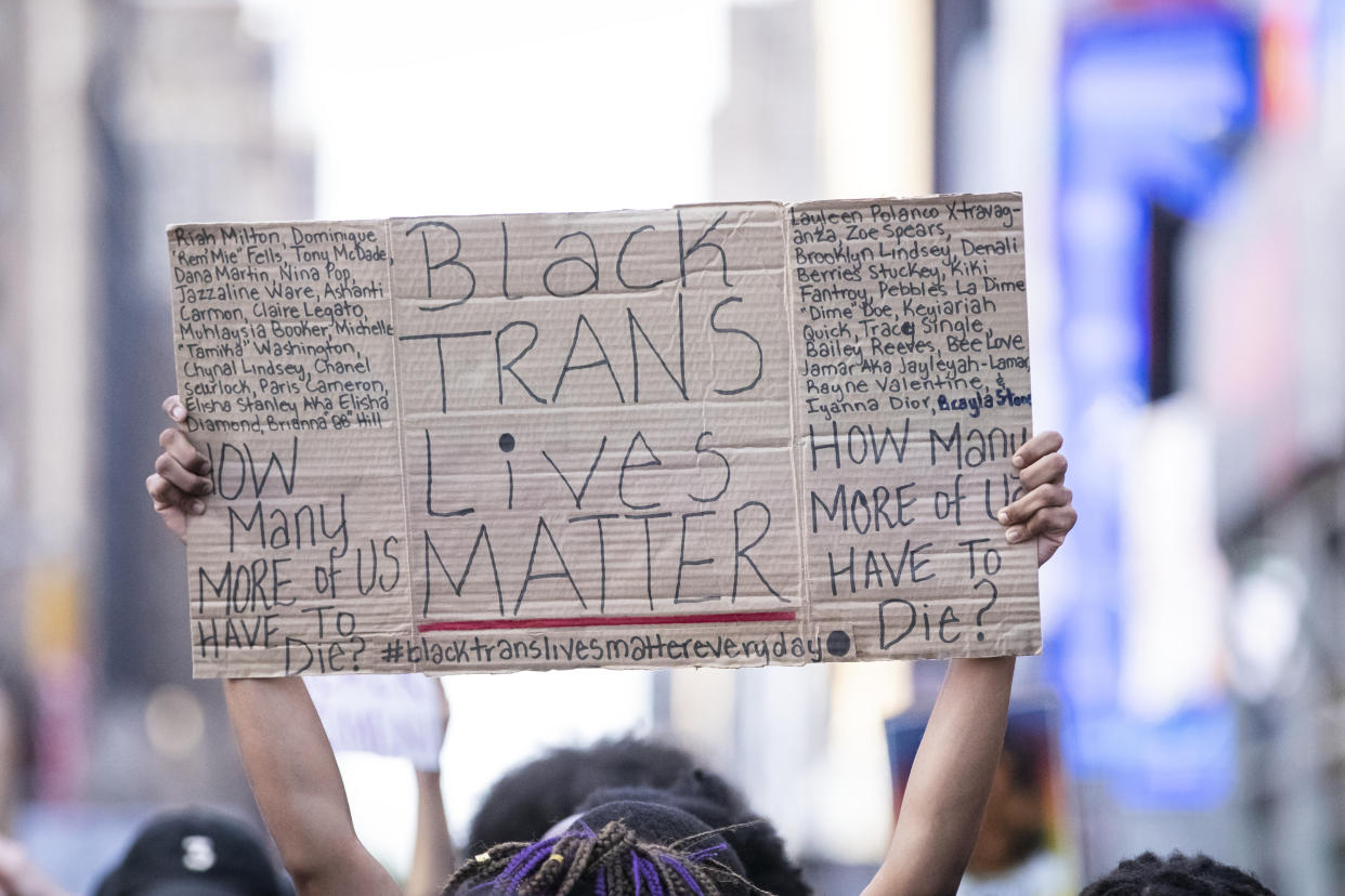 A protester holds a sign that say, "Black Trans Lives Matter" at a NYC protest in July, prompted by the continued epidemic of Black transgender murders around the country. (Photo: Ira L. Black/Corbis via Getty Images)