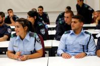 Arab Israeli police recruits (front row) attend a class at Israeli police academy center in Beit Shemesh, Israel August 24, 2016. Picture taken August 24, 2016. REUTERS/Ammar Awad