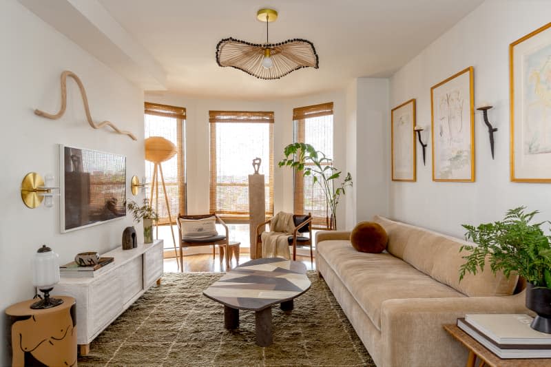 Beige velvet sofa in neutral living room.