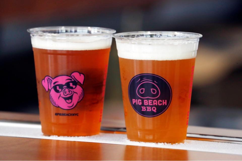 Pig Beach BBQ's 60-foot, wrap-around bar has a built-in "chill rail" for keeping drinks cold.