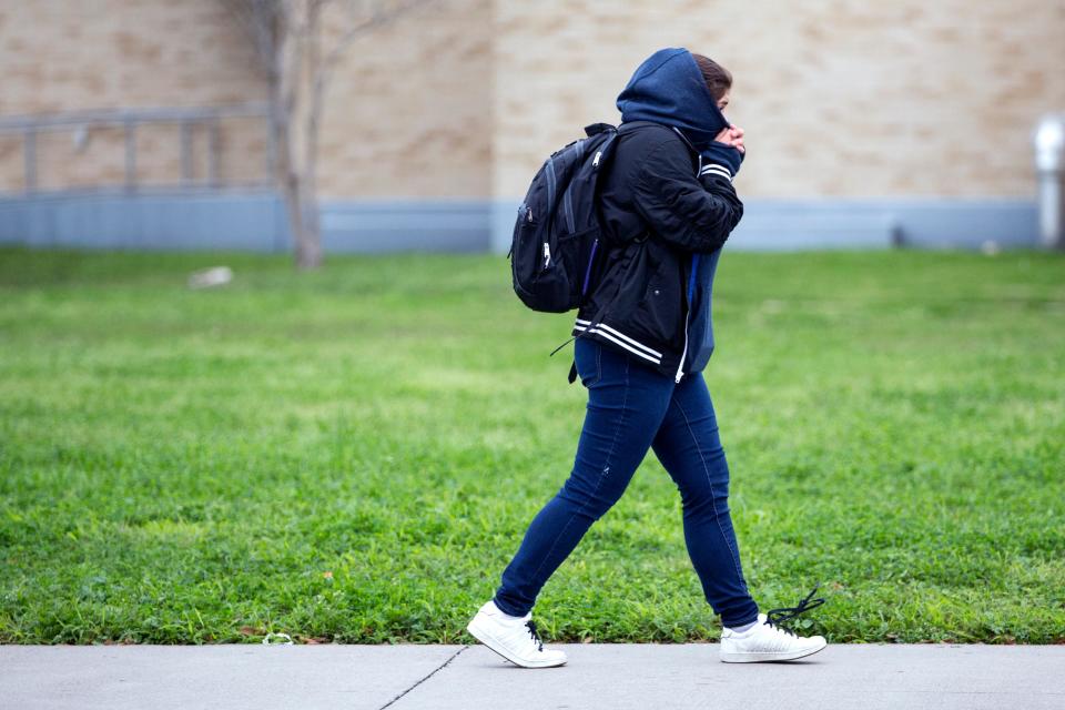 A Ray High School student walks to school on Monday, March 4, 2019.