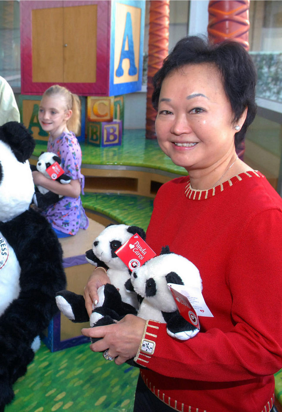 FILE- In this Feb. 4, 2006, file photo,Dr. Peggy Cherng, right, a member of the Board of Trustees at Childrens Hospital Los Angeles, and co-chair of Panda Express, displays some Panda bears that will be sold through Panda Express restaurants with 100-percent of the proceeds going to the Childrens Hospital Los Angeles and the American Red Cross. Andrew & Peggy Cherng came from China in 1966 and together founded the Panda Express restaurant chain, growing it into a $1.6 billion business that operates 1,500 locations.(AP Photo/Childrens Hospital Los Angeles, Bob Riha, Jr., File )