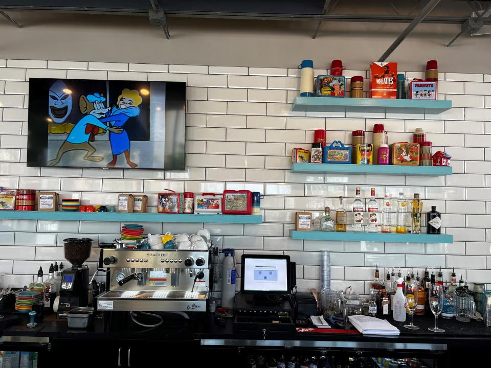 The back bar at The Breakfast Club features old lunch boxes and Thermoses.