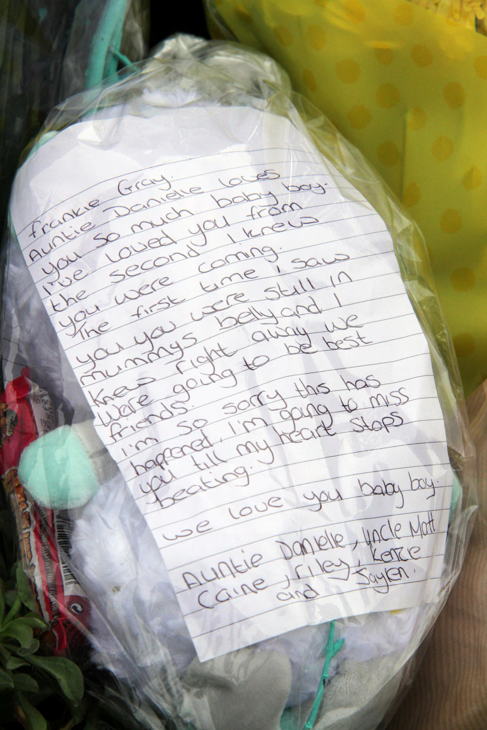 Relatives leave flowers at the entrance to Tencreek Holiday Park, Looe, Cornwall.  Frankie Macritchie was killed by a dog in the early hours of Saturday morning.  