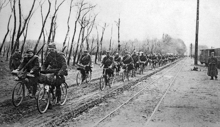 A picture of a postcard released by the Historial de Péronne Museum of World War 1 shows French scouts heading on their bicycles to Ypres, Belgium, in the Flemish province of West Flanders, during the First World War