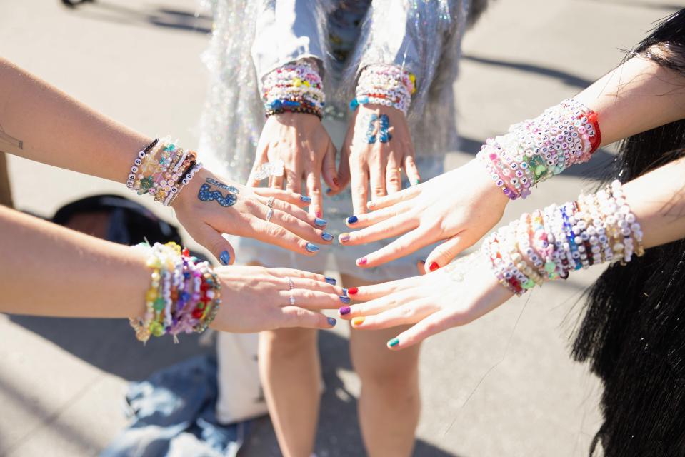 Fans show friendship bracelets at Taylor Swift's performance at Friends Arena on May 17, 2024 in Stockholm, Sweden.