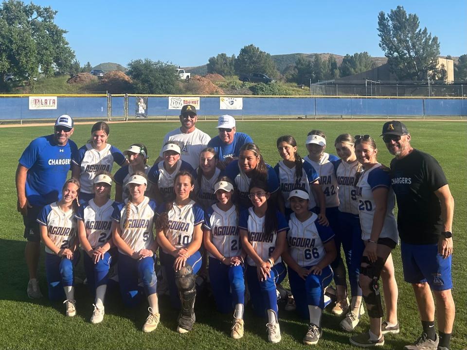 The Agoura High softball team poses for a photo after its 9-8 win over Charter Oak in a CIF-SS Division 3 quarterfinal game on Thursday.