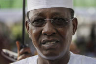 FILE - In this Friday, May 29, 2015 file photo, Chadian President Idriss Deby Itno arrives for the inauguration of the new Nigerian President, Muhammadu Buhari, at the eagle square in Abuja, Nigeria. Deby, who ruled the central African nation for more than three decades, was killed on the battlefield Tuesday, April 20, 2021 in a fight against rebels, the military announced on national television and radio. (AP Photo/Sunday Alamba, File)