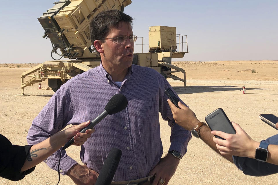 Defense Secretary Mark Esper talks to reporters at Prince Sultan Air Base in Saudi Arabia, Tuesday, Oct. 22, 2019, where he saw a Patriot missile battery that the US sent to Saudi to help protect the kingdom against the Iranian threat. (AP Photo/Lolita Baldor)