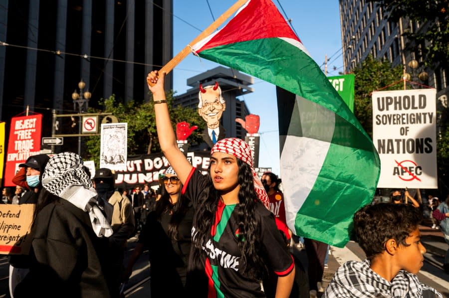 Amaani Cassim, 16, joins several thousand other demonstrators marching against the APEC (Asia-Pacific Economic Cooperation) Summit, Sunday, Nov. 12, 2023, in San Francisco. (AP Photo/Noah Berger)