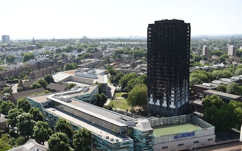 The charred remains of Grenfell Tower - Credit: PA