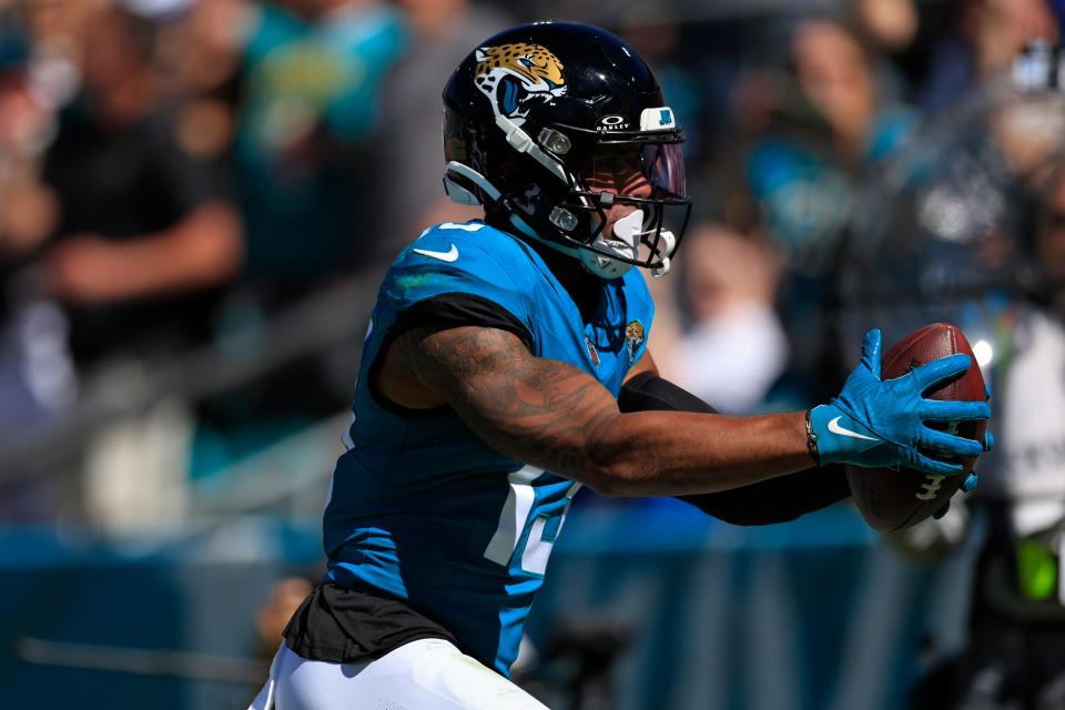 Jacksonville Jaguars wide receiver <a class="link " href="https://sports.yahoo.com/nfl/players/31017" data-i13n="sec:content-canvas;subsec:anchor_text;elm:context_link" data-ylk="slk:Christian Kirk;sec:content-canvas;subsec:anchor_text;elm:context_link;itc:0">Christian Kirk</a> (13) scores a touchdown during the second quarter of an NFL football matchup Sunday, Oct. 15, 2023 at EverBank Stadium in Jacksonville, Fla. The Jacksonville Jaguars defeated the <a class="link " href="https://sports.yahoo.com/nfl/teams/indianapolis/" data-i13n="sec:content-canvas;subsec:anchor_text;elm:context_link" data-ylk="slk:Indianapolis Colts;sec:content-canvas;subsec:anchor_text;elm:context_link;itc:0">Indianapolis Colts</a> 37-20. [Corey Perrine/Florida Times-Union]