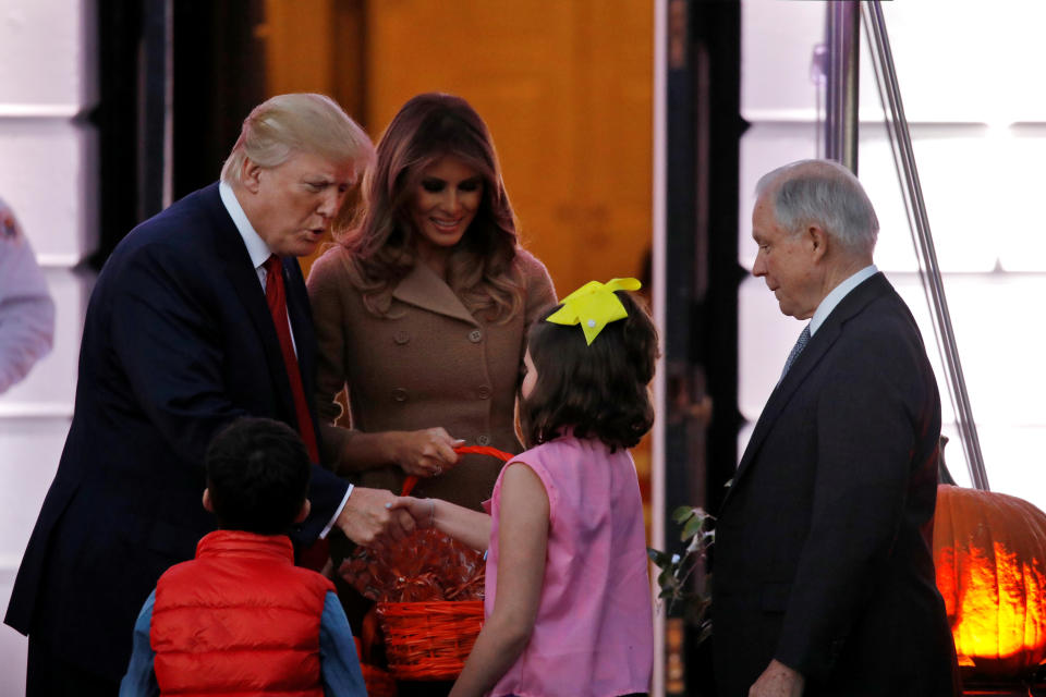 <p>U.S. Attorney General Jeff Sessions (R) accompanies children while U.S. President Donald Trump reacts as he and First Lady Melania Trump give out Halloween treats to children from the South Portico of the Washington, D.C. on Oct. 30, 2017. (Photo: Carlos Barria/Reuters) </p>