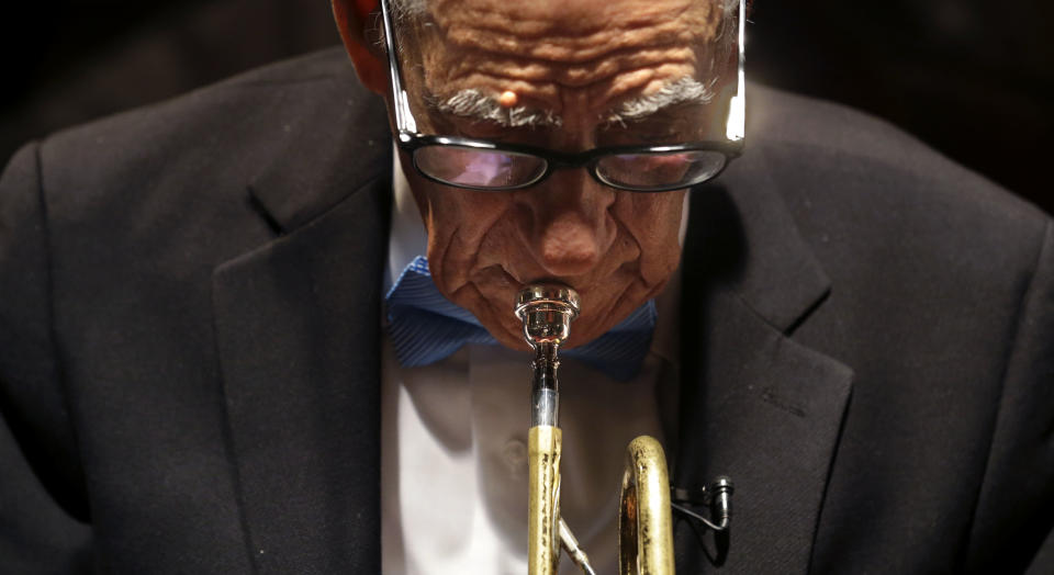 Venerable Dixieland jazz musician Lionel Ferbos performs at his 102nd birthday party at the Palm Court Jazz Cafe in New Orleans, Wednesday, July 17, 2013. Ferbos, who bought his first cornet at a Rampart Street pawn shop when he was 15, is believed to be the oldest actively working musician in the city. His body isn’t without signs of age. He’s been in and out of the hospital in recent years and had a pacemaker implanted last year. He sometimes uses a wheelchair to get around, but he remains determined to sing and blow. (AP Photo/Gerald Herbert)