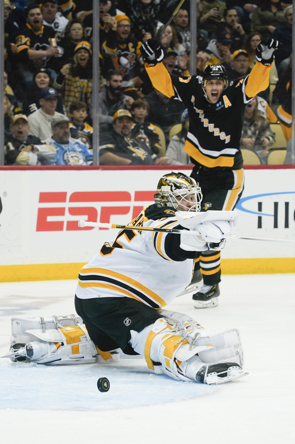 Pittsburgh Penguins' Evgeni Malkin (71) celebrates a goal by Rickard Rakell on Boston Bruins goaltender Linus Ullmark (35) during the second period of an NHL hockey game Tuesday, Nov. 1, 2022, in Pittsburgh. (AP Photo/Keith Srakocic)