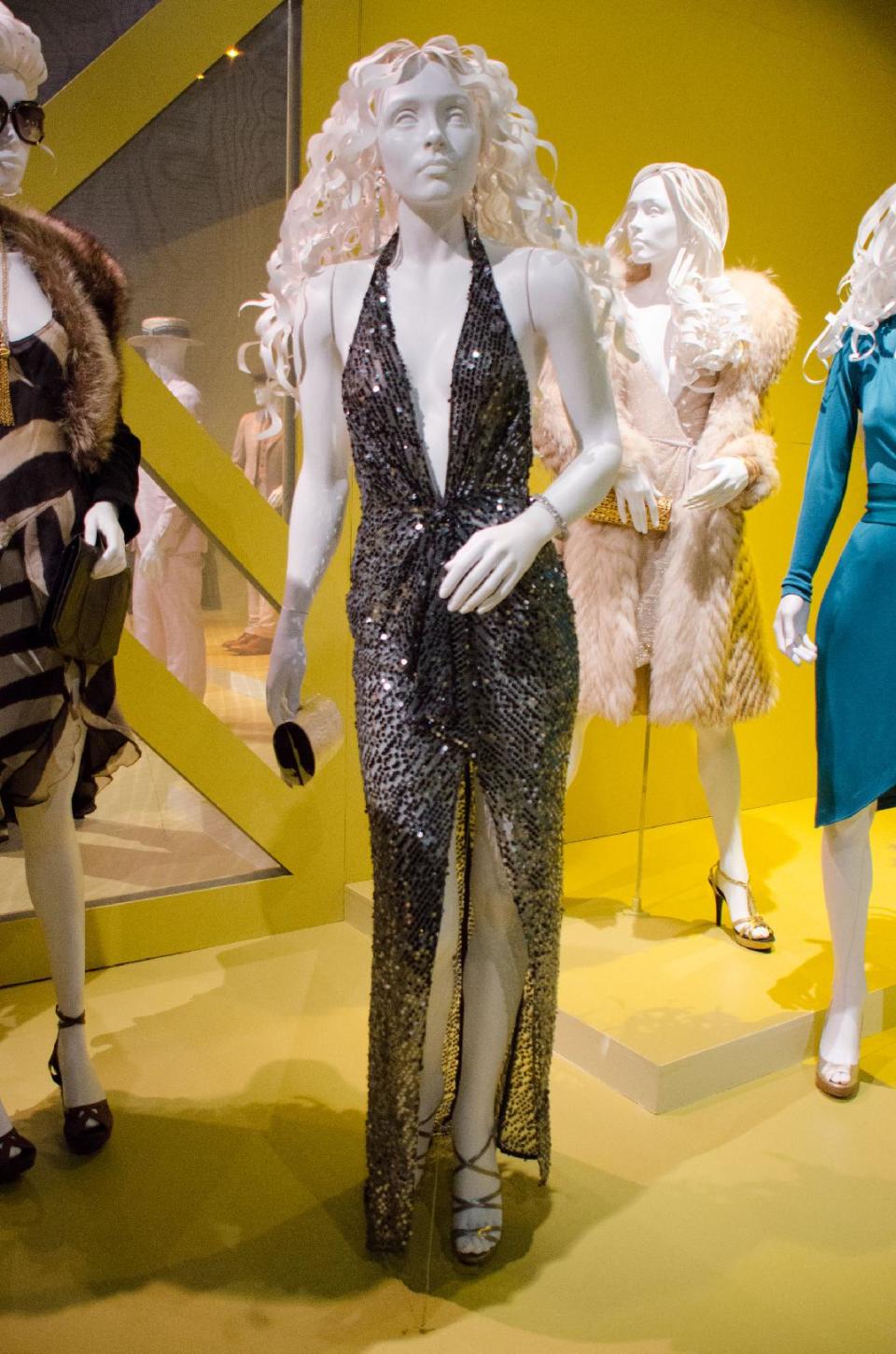 In this Saturday, Feb. 8, 2014 photo, 2014 Oscar nominated costumes for "American Hustle," by costume designer Michael Wilkinson are on display at the 22nd annual Art of Motion Picture Costume Design Exhibit, in Los Angeles, Calif. The Fashion Institute of Design & Merchandising holds its free-to-the-public Art of Motion Picture Costume Design exhibit on view until April 26, 2014, featuring this year's five Oscar nominees: "American Hustle," "The Grandmaster," "The Great Gatsby," "The Invisible Woman" and "12 Years A Slave," in Los Angeles. (Photo by Tonya Wise/Invision/AP)