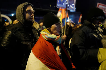 Demonstrators are seen outside the headquarters of the Hungarian state television during a protest against a proposed new labor law, billed as the "slave law", in Budapest, Hungary, December 17, 2018. REUTERS/Bernadett Szabo