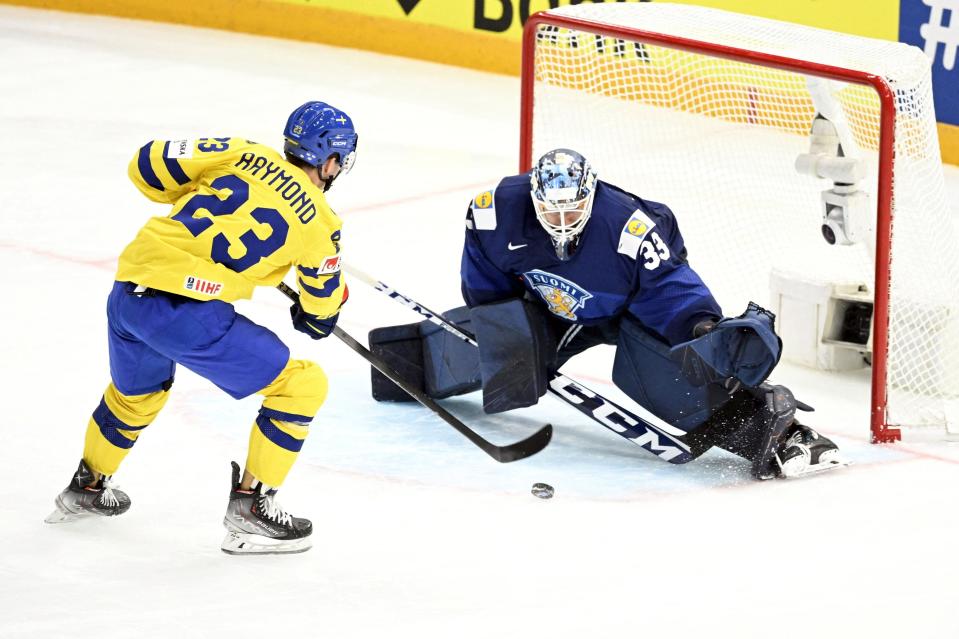 Sweden's forward Lucas Raymond scores a goal against Finland's goalkeeper Emil Larmi during the IIHF Ice Hockey Men's World Championships Preliminary Round - Group A match between Finland and Sweden in Tampere, Finland, on May 15, 2023.