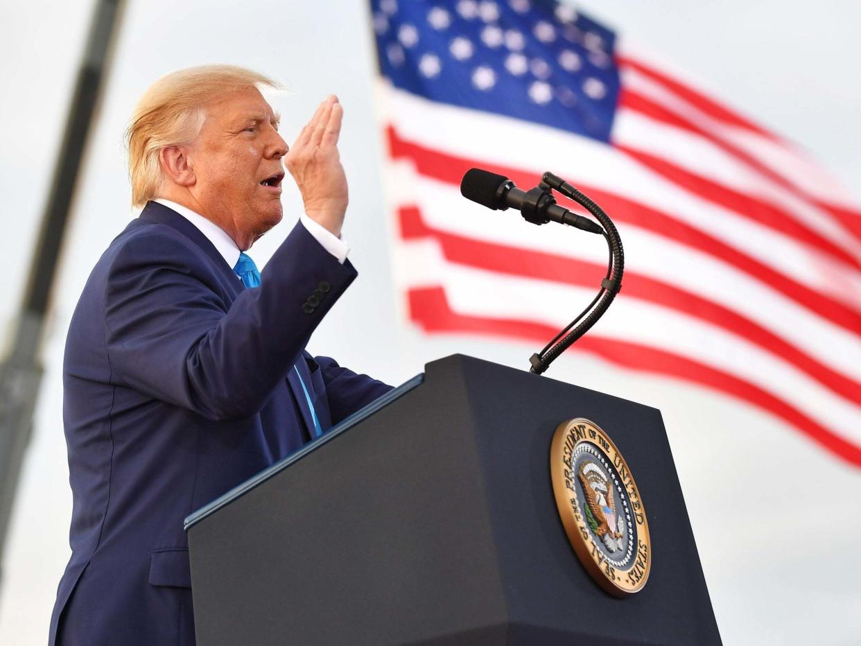 US president Donald Trump addresses a crowd on Thursday, amid accusations that he called war dead 'losers': AFP via Getty Images