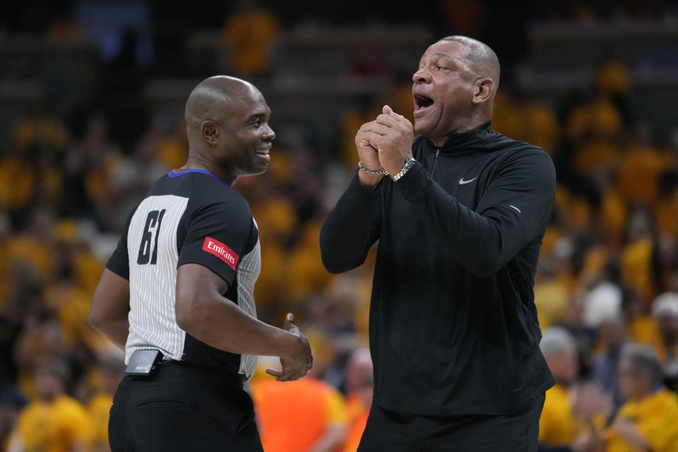 Milwaukee Bucks head coach Doc Rivers, right, questions a call during the second half against the Indiana Pacers in Game 6 in an NBA basketball first-round playoff series, Thursday, May 2, 2024, in Indianapolis. (AP Photo/Michael Conroy)