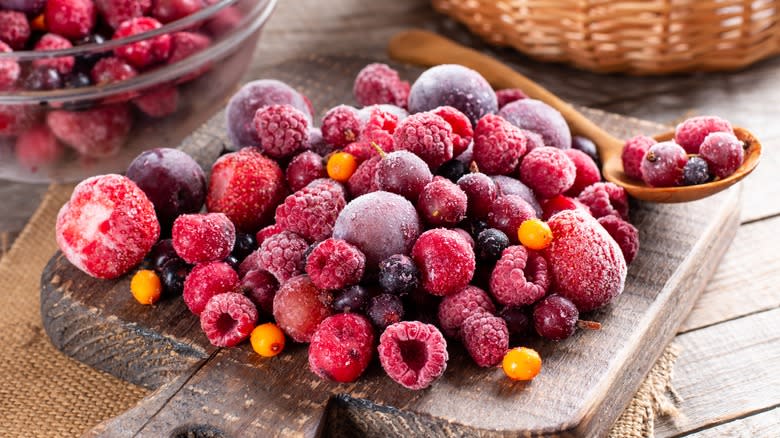 Frozen berries on cutting board