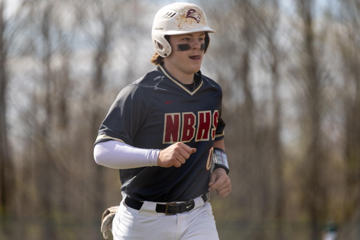 New Brighton Brock Budacki (0) jogs off the field after being taken out for a pinch runner in the first inning during the Lions WPIAL Class 2A Section II battle against Laurel on April 22.