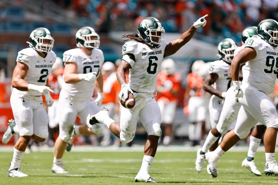 Michigan State linebacker Quavaris Crouch (6) celebrates after recovering a fumble during the first quarter against Miami, Saturday, Sept. 18, 2021, in Miami Gardens, Fla.