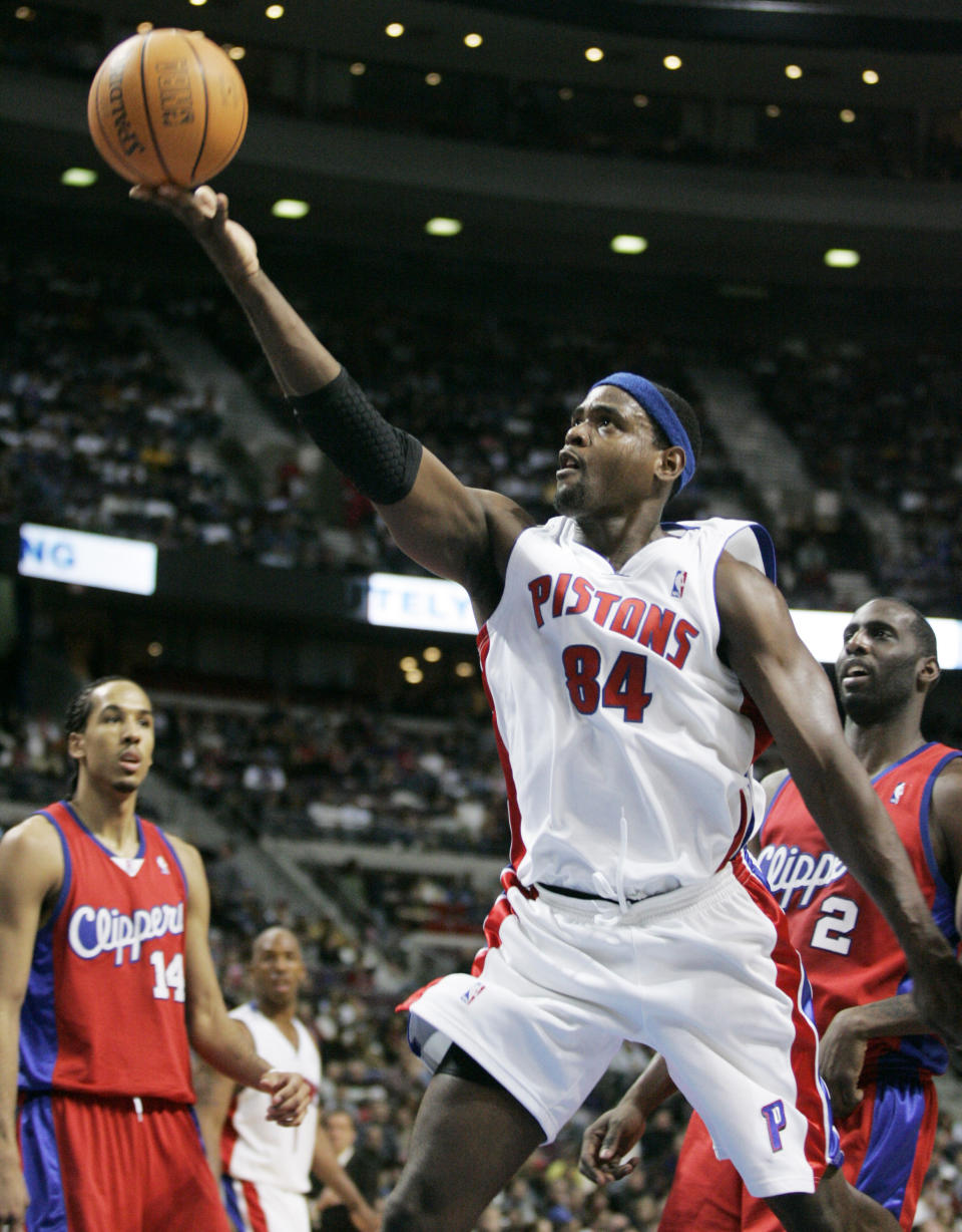 FILE- In this Feb. 12, 2007, file photo, Detroit Pistons center Chris Webber (84) shoots in front of Los Angeles Clippers forward Tim Thomas (2) and guard Shaun Livingston (14) during the second half of an NBA basketball game in Auburn Hills, Mich. Webber is among 13 finalists for enshrinement later this year into the Basketball Hall of Fame. (AP Photo/Duane Burleson, File)